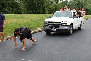 Strong man pulling truck
